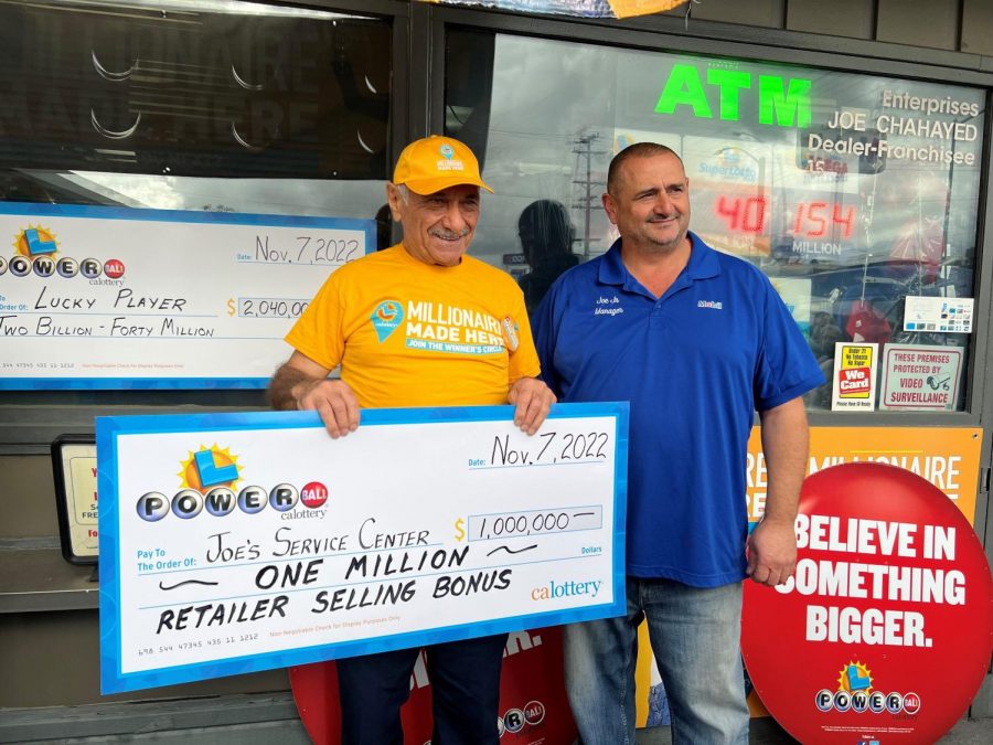 The owner of the store that sold the winning ticket is awarded a $1 million check.