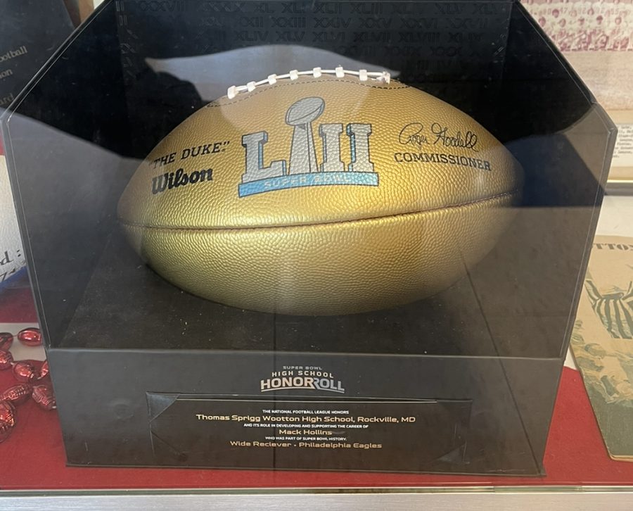 A game ball from the super bowl Mack Hollins won is displayed in Wootton’s trophy case.