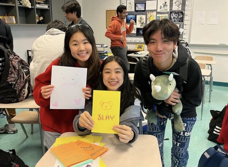 Junior Jessica Chen, sophomore Emma Yuan and freshman Ryan Shin make cards with Paper Bridges. The club is working to connect students with Pen Pals from the Rockville Senior Center.
