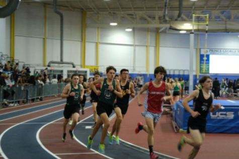 Runners of the two-mile race turn the first corner hard in the opening meet.