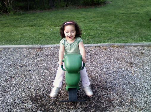 Junior Niki Naderi is captured by her mother at age two playing at the local playground.