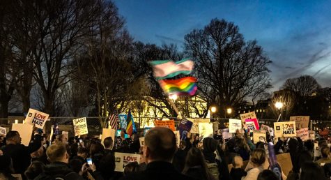 Activists assemble in front of the White House to protest discrimination against LGBTQ students based on gender identity.