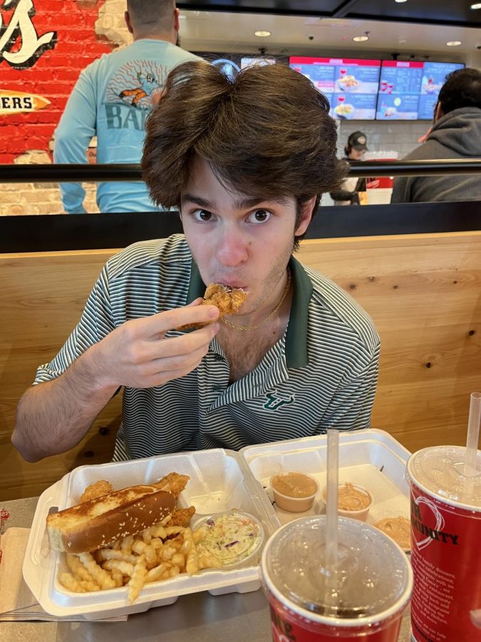 Senior Luke Danielian enjoys The Box Combo from the Raising Canes Sterling, VA, location.