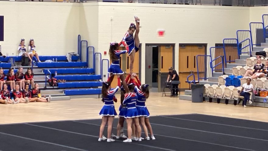 Varsity+cheerleading+performs+during+the+regional+competition.