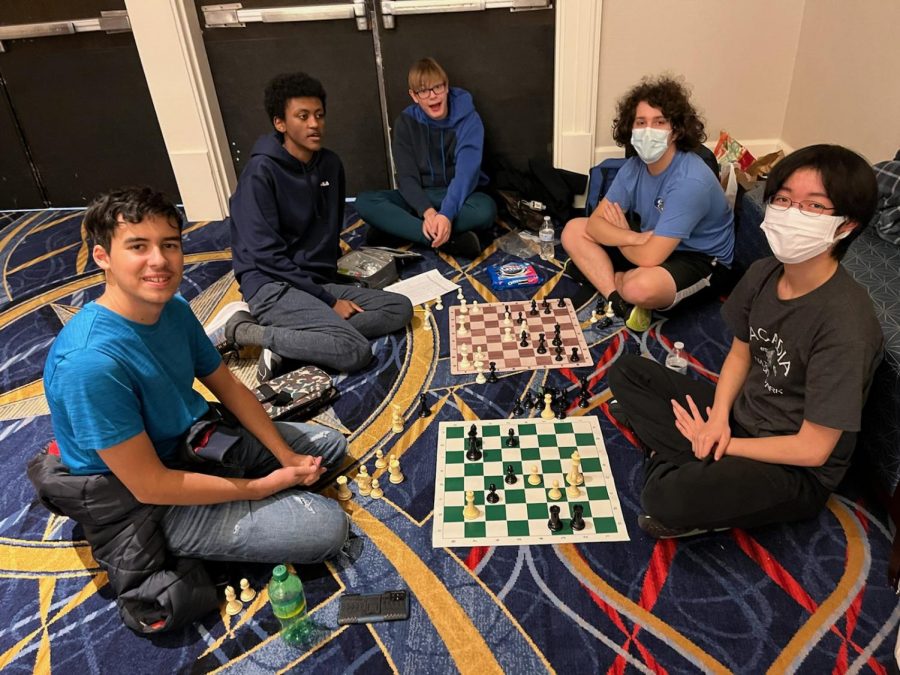 Freshman Brandon Chen, sophomores Nathan Mulugeta and Stanislaw Blizniuk, junior Jordi Revilla, and senior Ben Shoykhet analyze games after a long round to learn and improve.