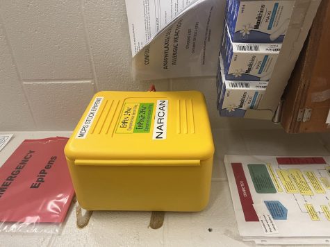Narcan, a medication used to reverse or reduce the effects of opioids, is located in the nurses office.