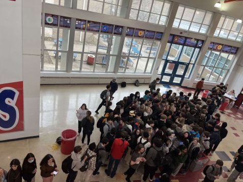 Seniors rush and push to get to the front of the first-come-first-serve parking permit pickup line in the Commons on Jan. 26 to try to get the best parking spot.