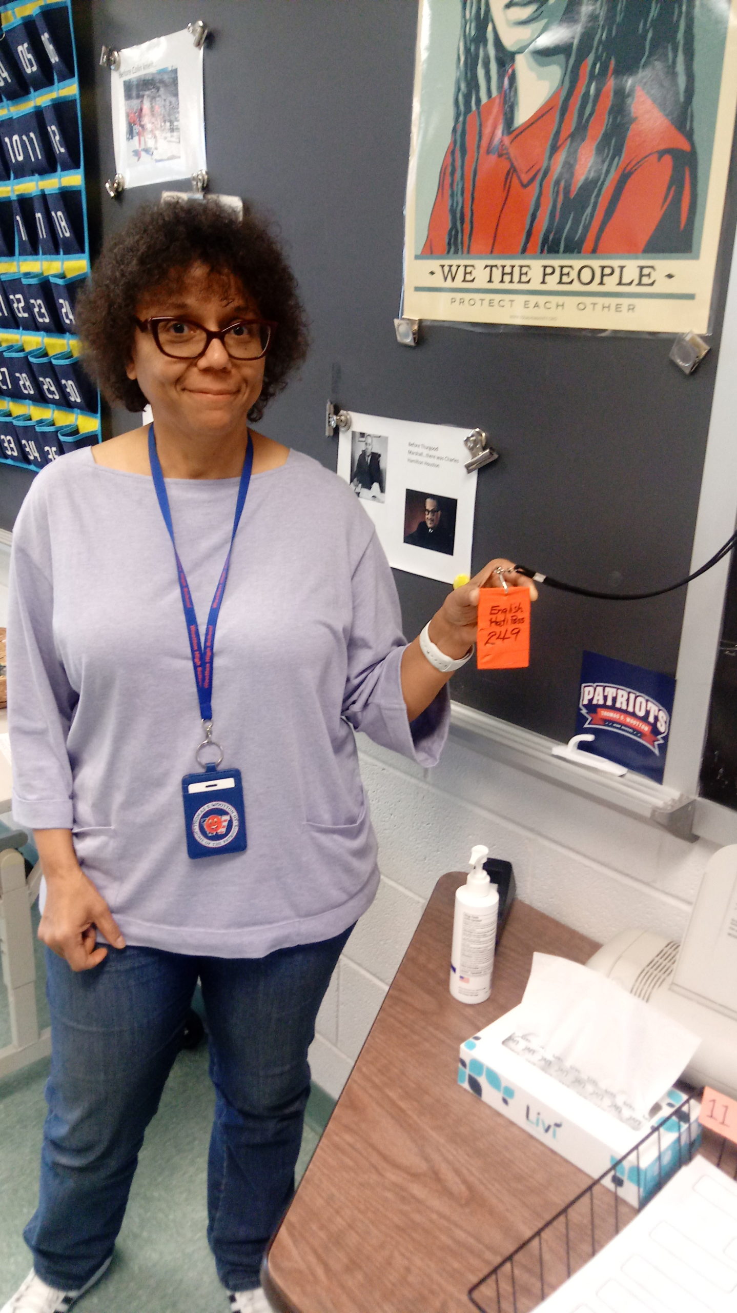 English teacher Dominique Parker presents her self-made, hand-made hall pass. In response to the disappearance of the passes originally given, Parker made her own pass out of tape, so students could use the restroom or get water and still follow the rules.