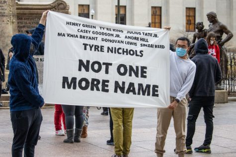 Protesters of Tyre Nichols unlawful murder stand in front of Ohio Statehouse 8 with a chilling reminder of previous unjust police brutality.