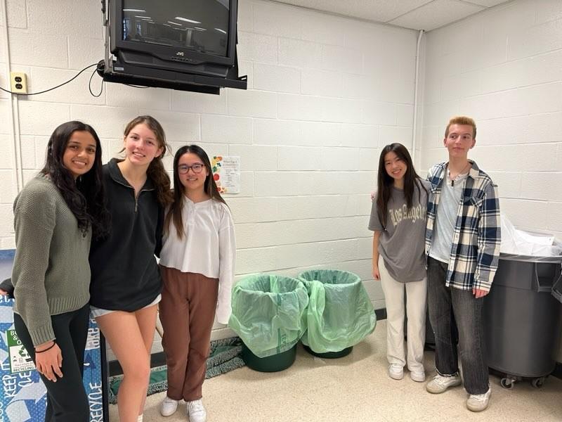 The+founders+of+the+composting+initiative%2C+juniors+Divya+Subramanian%2C+Sofia+Gabrielle%2C+Emily+Liu%2C+Ashley+Chan%2C+and+Nico+DOrazio%2C+stand+by+their+green+composting+bins+in+the+cafeteria.