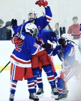 The Patriots celebrate a goal against  Sherwood in the playoffs.