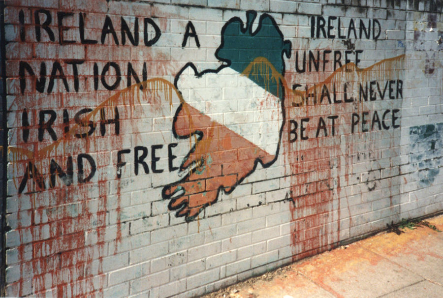 Nationalist+graffiti+on+a+public+wall+in+the+Northern+Irish+town+of+Derry.+Everyday+citizens+were+drawn+into+the+conflict%2C+which+resulted+in+over+3%2C000+deaths%2C+as+towns+became+unofficial+battlefields+for+bombings+and+snipers.