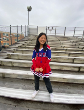 Junior Samantha Lau smiles before a performance on Sept. 30.  This was before we performed at a football game with a routine I helped choreograph. It was a rainy night so there were not many people there, but I still had fun, Lau said.