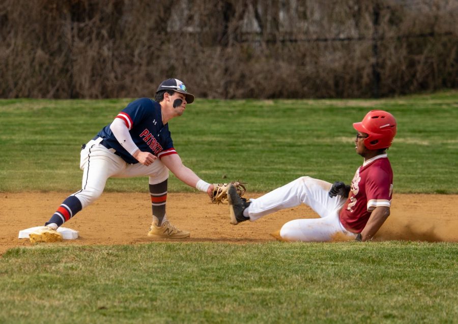 Second baseman Ethan Goldstein tags out a Paint Branch runner during this seasons opening game.