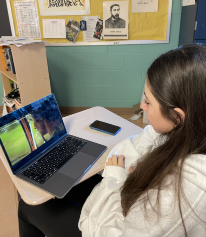 Freshman Jenny Brailovsky watches episode six of Outer Banks season three during her free time in class.