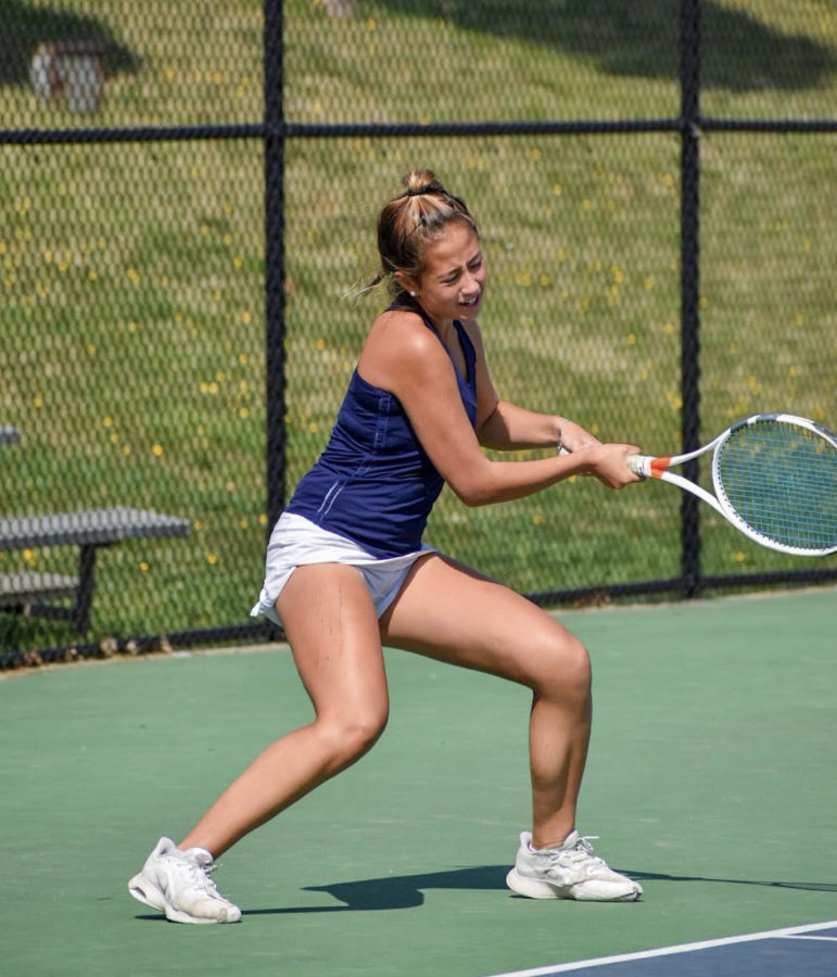 Junior Naomi Esterowitz returns a serve with her backhand during her match against Northwest last year.