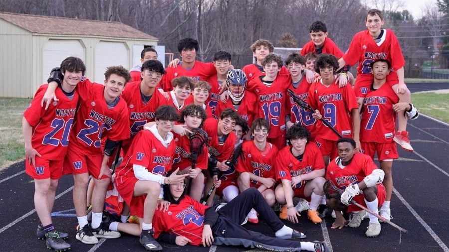 The JV boys lacrosse team celebrates their first win over Clarksburg.