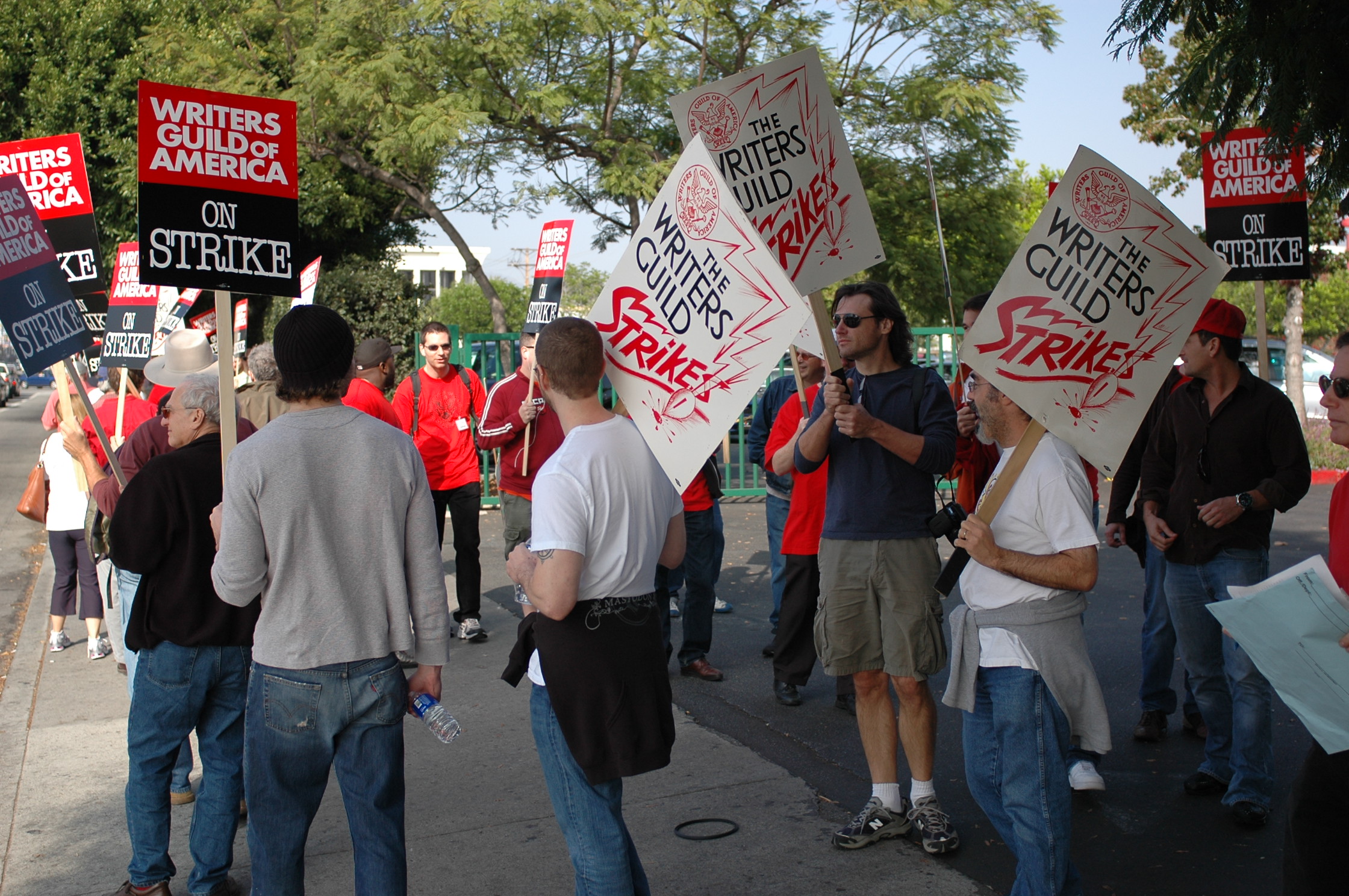 Protesters and writers from the Writers Guild of America strike and protest for higher writer and director wages.