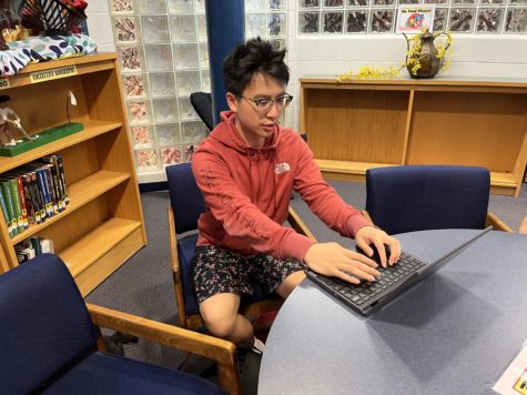 Senior Mike Peng scrambles to complete his AP Statistics final project.