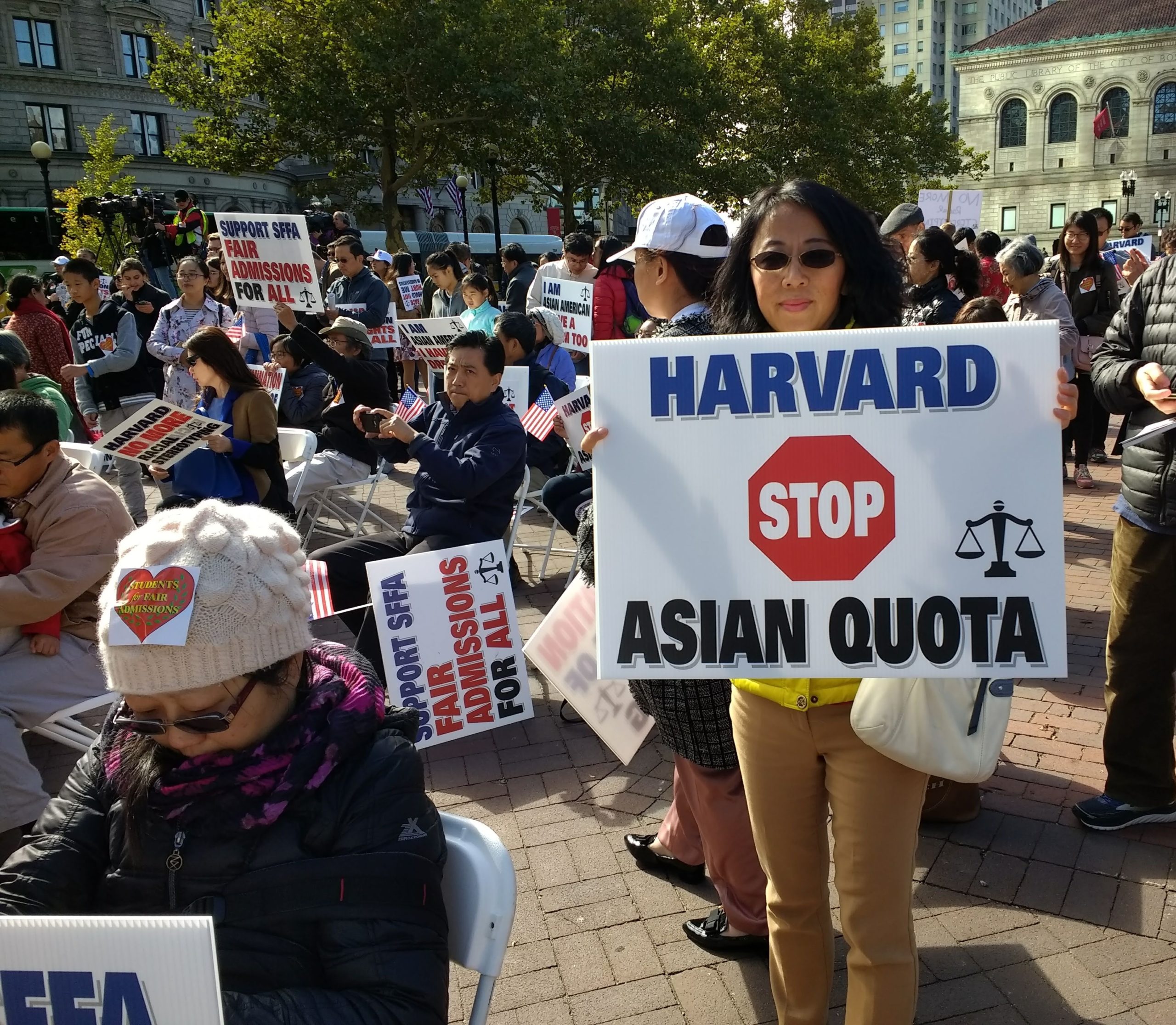 Members of the Support Fair Admissions for All group rally in opposition of affirmative action policies outside the Supreme Court, where judges hear a case arguing that Asian students are not examined under the same provisions as other minority applicants of Harvard University.