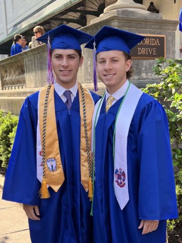 Graduates Josh Mirsky and Max Mirsky celebrate their graduation outside of DAR.