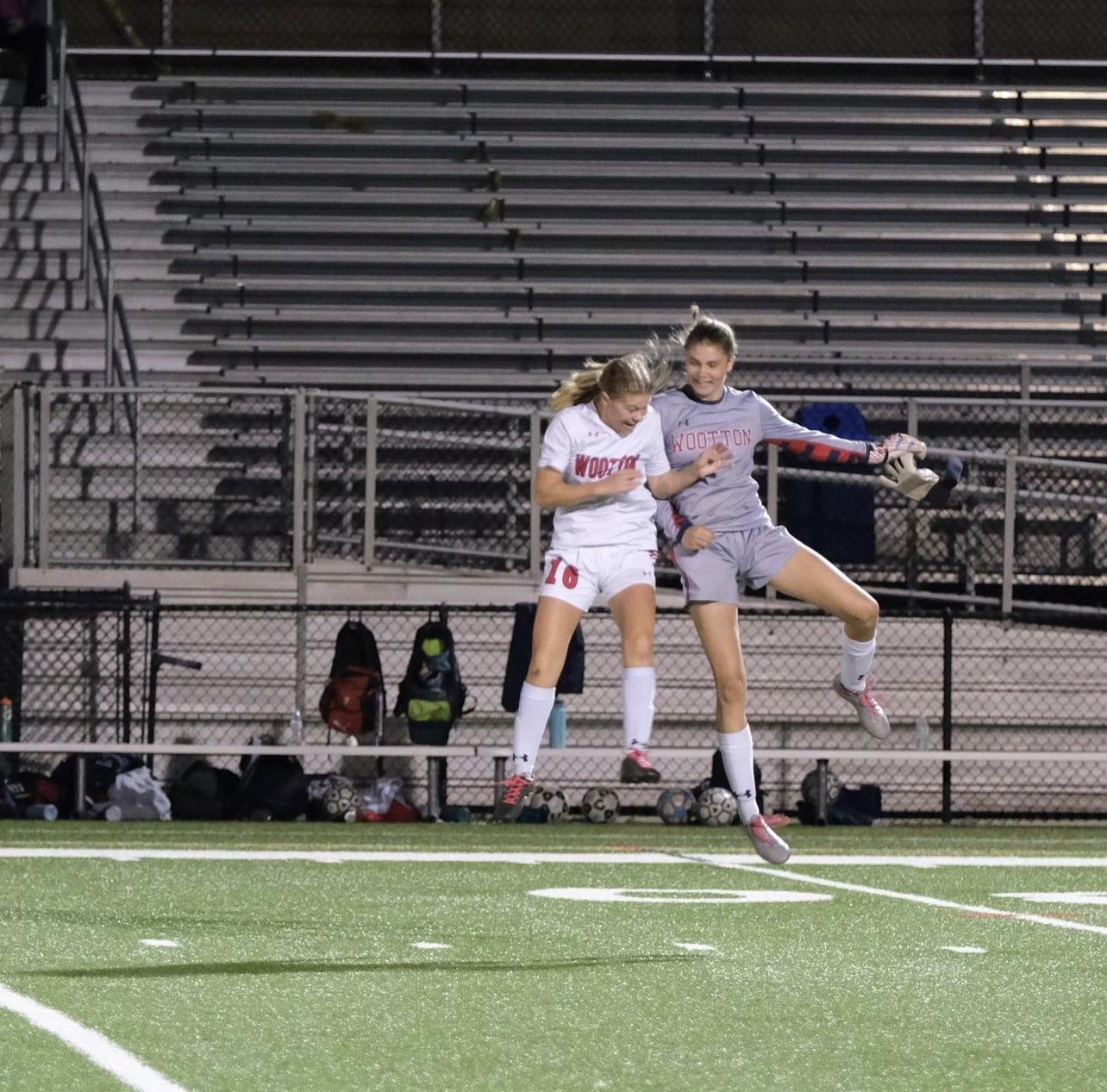Seniors Kaitlin Mariani and Karen Potts celebrate after winning their final game.