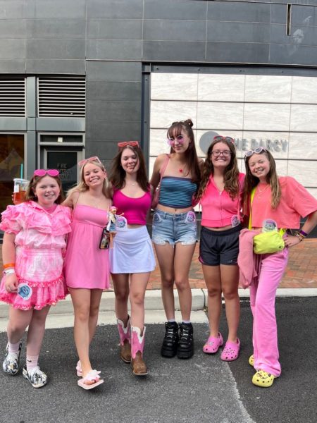 Junior Lyla Dinallo (far right) and friends see the Barbie movie decked out in pink at Bethesda Row on Aug. 5