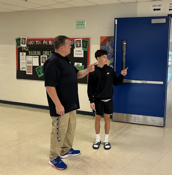 New security team leader Ray Blankenship directs junior Jake Lachter to his class. Blankenship wants students to know that the security team is there to support and connect with them.
