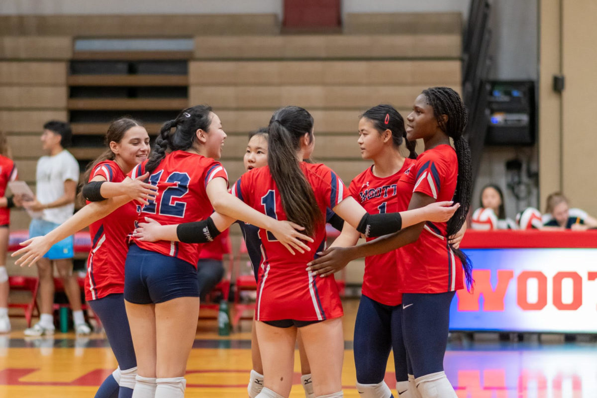 Allie Botha, Kaylee Fang, Jessica Chen, Taryn Sy, Rachel Huanh and Danielle Oyekola huddle together on the court during their game against Our Lady Of Good Counsel High School on Sept.13.