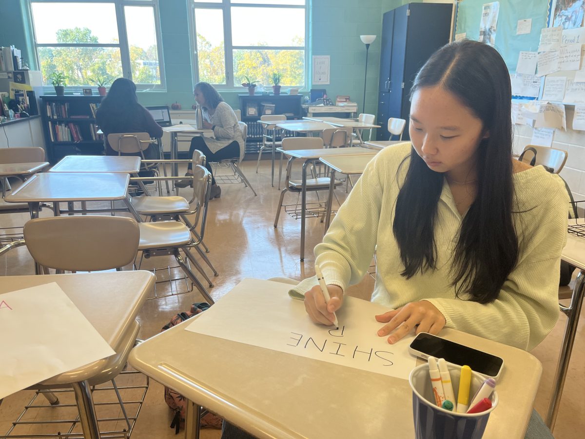 Junior Rebecca Gao creates an affirmation poster during the Patriot Minds Matter meeting on Oct. 26.