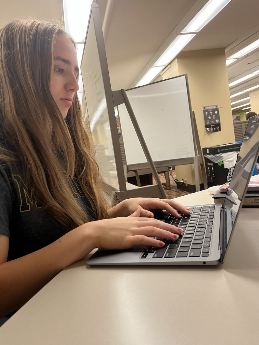 Senior Julia Messing works on her AP Literature essay. I feel like some of my teachers leave big assignments towards the end, but I also have some that are more conscious about it, Messing said.