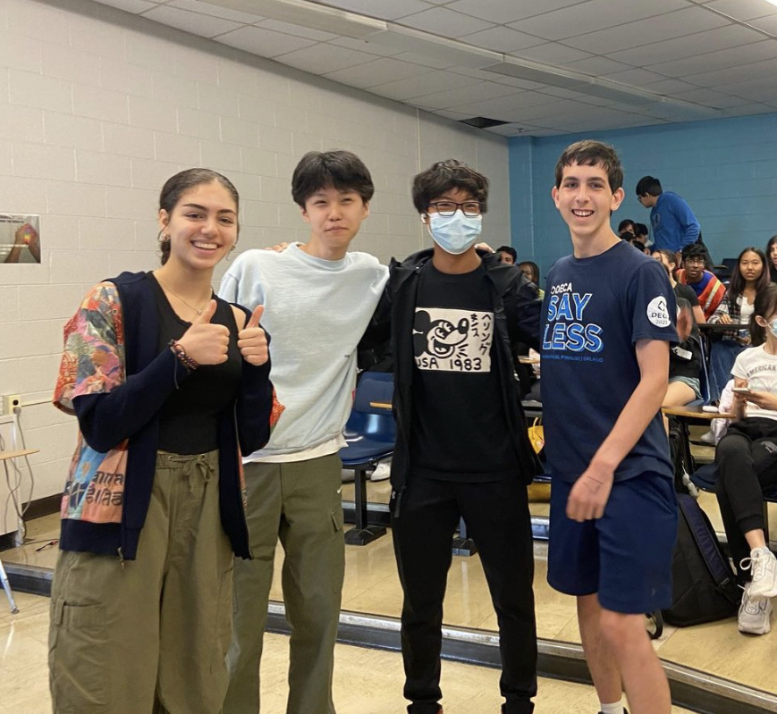 Co-President Kristina Khrimian, VP of Training Alvin Wang, Dylan Xu, and VP of Training Charles Freedman celebrate at the first DECA meeting of the year on Oct. 4.