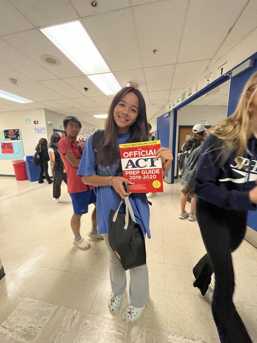Junior Cayla Schwartz is prepping for the ACT. The prep guide is a common study aide for juniors to help them prepare for their test.