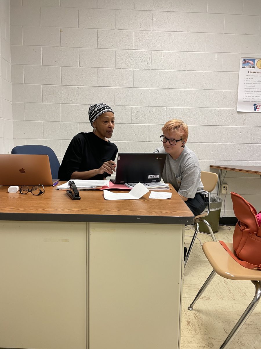 Connections teacher Freda Jones and freshman Kylie DeNio work together on an English assignment during second period connections class.