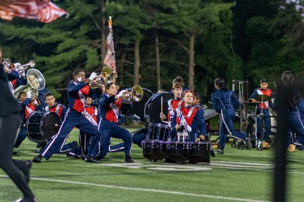 The marching band performs at halftime during the football game against Churchill on Sept. 14.