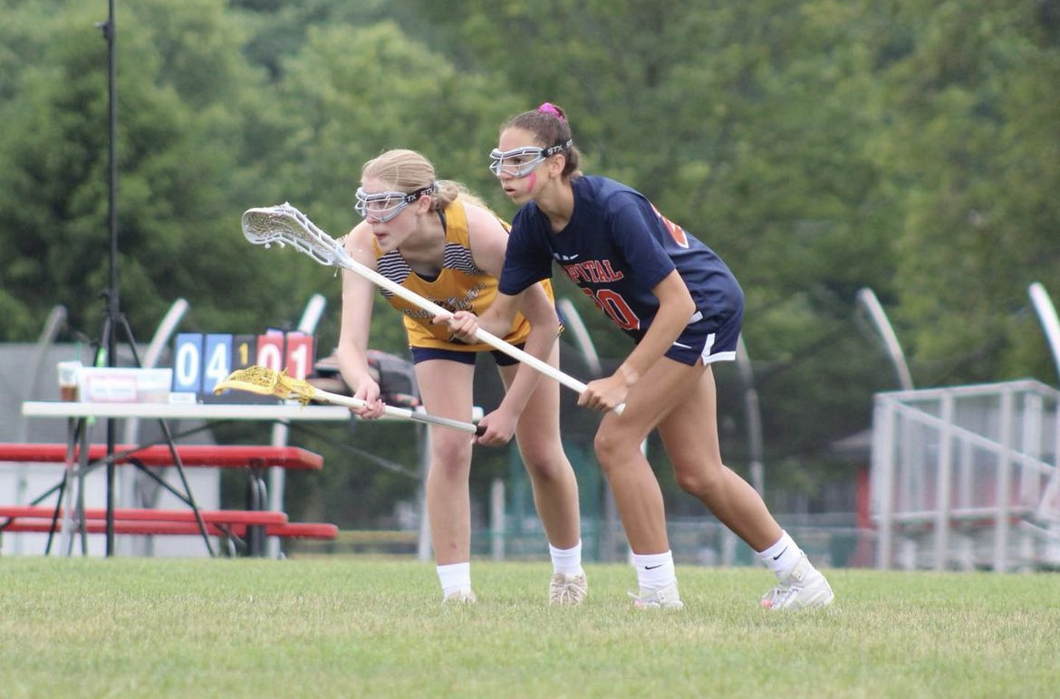 Sophomore Maya Bellamy prepares to win the draw at her club lacrosse match. I am excited to watch my sport in the next Olympics, Bellamy said.