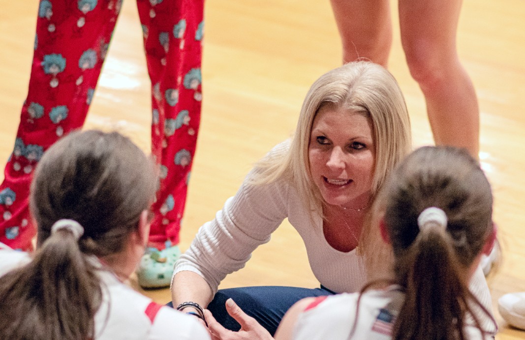 Girls basketball coach Maggie Dyer provides instruction to her team on Mar. 3 in their regional final game against Churchill.