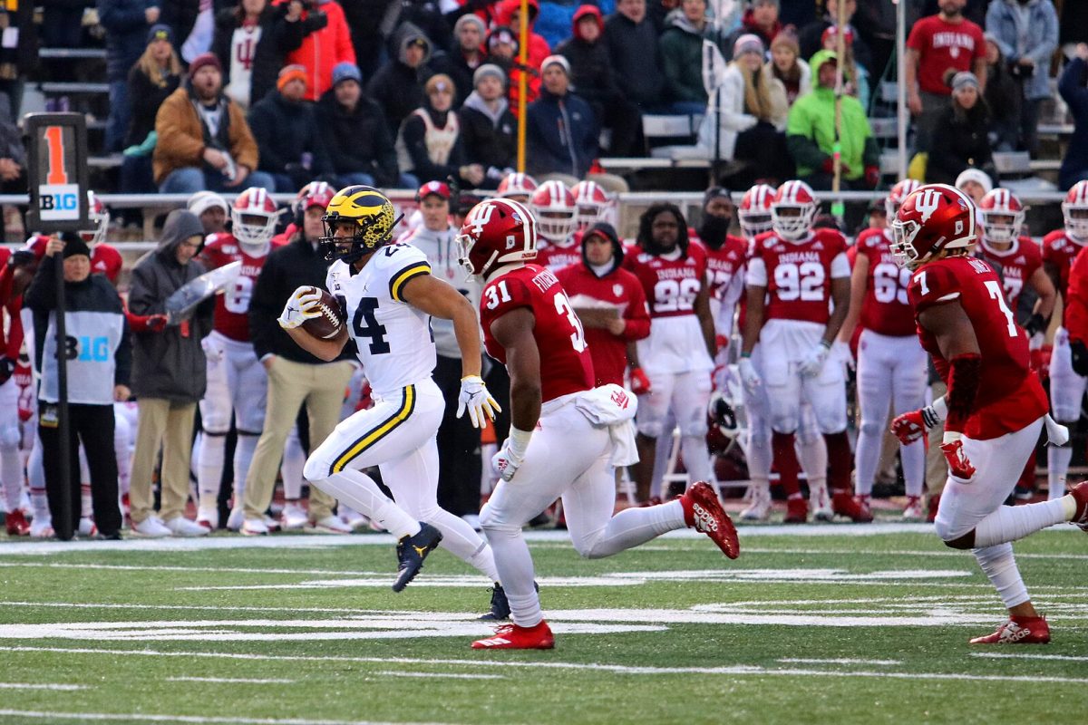 The Michigan Wolverines in possession of the ball against the Indiana Hoosiers.