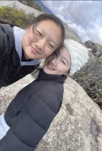 Junior Katherine Hua and her sister Emily Shao hike through mountains last December during winter break.