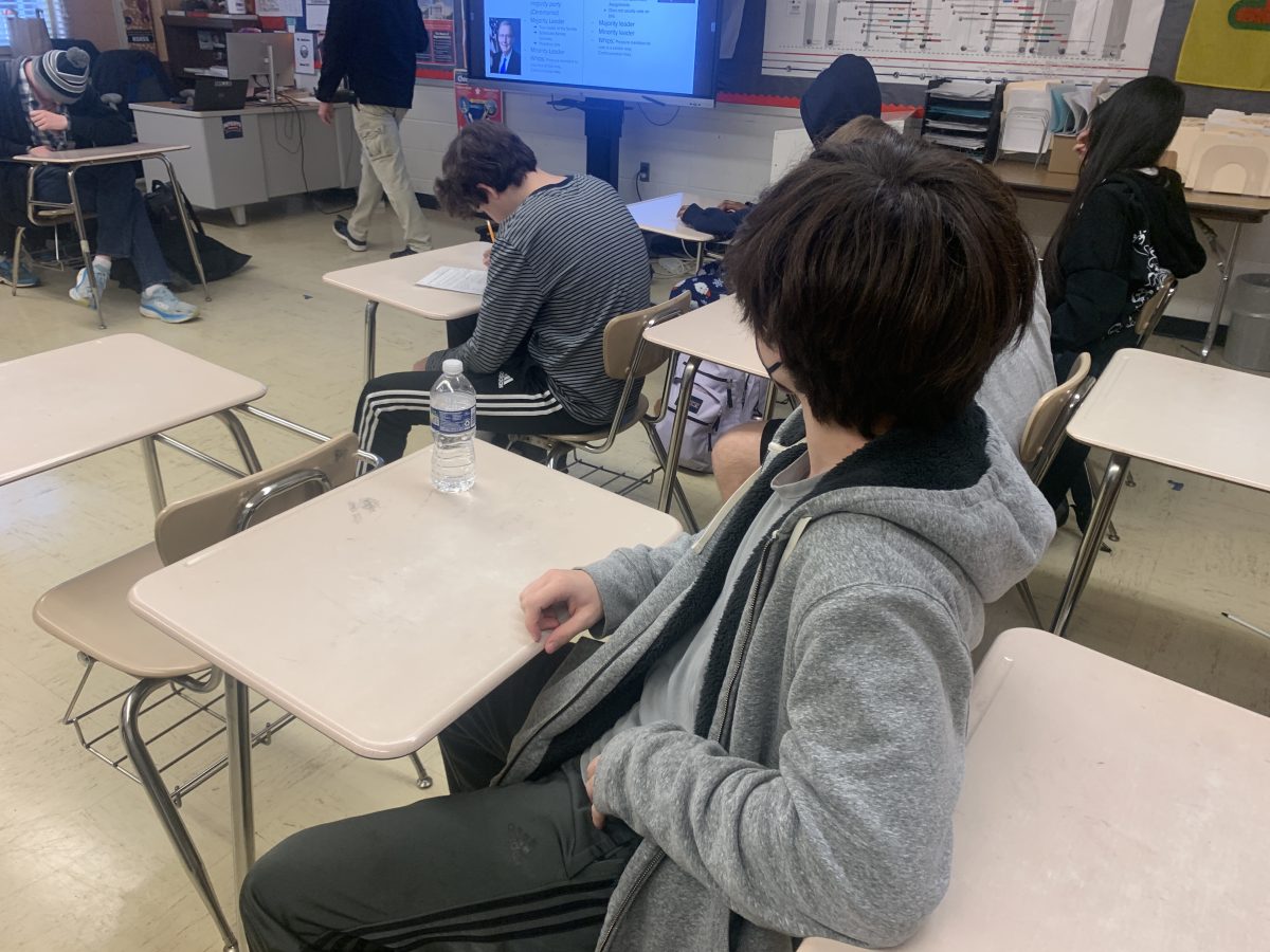 Freshman Benjamin Hall sits in AP NSL while listening to music. Music can be beneficial to students as it allows them to perform better. I listen to music in class because it helps boost my memory and helps with retaining information, Hall said.