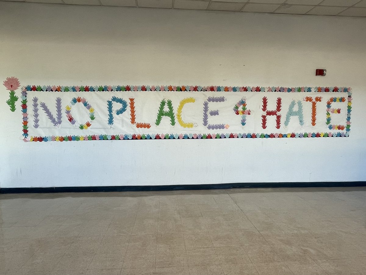 The+Restorative+Justice+committee+created+a+mural+filled+with+signatures+of+students+and+staff+around+the+school+to+promote+the+No+Place+for+Hate+initiative.+The+mural+can+be+found+on+the+Commons+bridge.