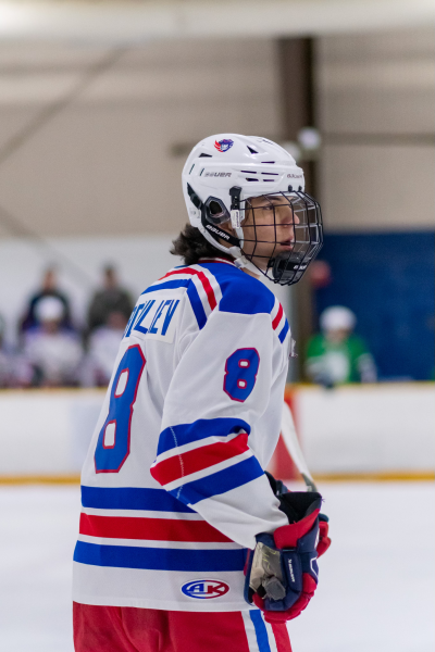 Senior defender Ilhom Abdulaev skates on the ice during the Patriots’ game against WJ. Abdulaev, along with junior Sam Hosier, led the team in scoring during the season, with a combined 84 points. “Wootton hockey will always be with me throughout the rest of my life,” Abdulaev said.