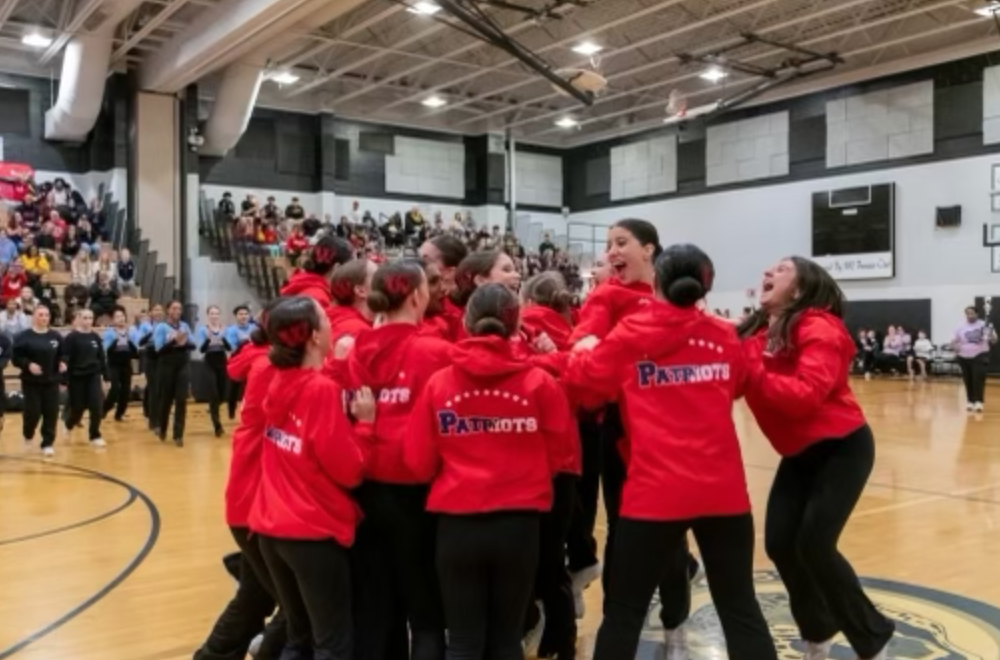 Poms celebrates their first-place victory at the Northwest invitational on Jan. 27. 