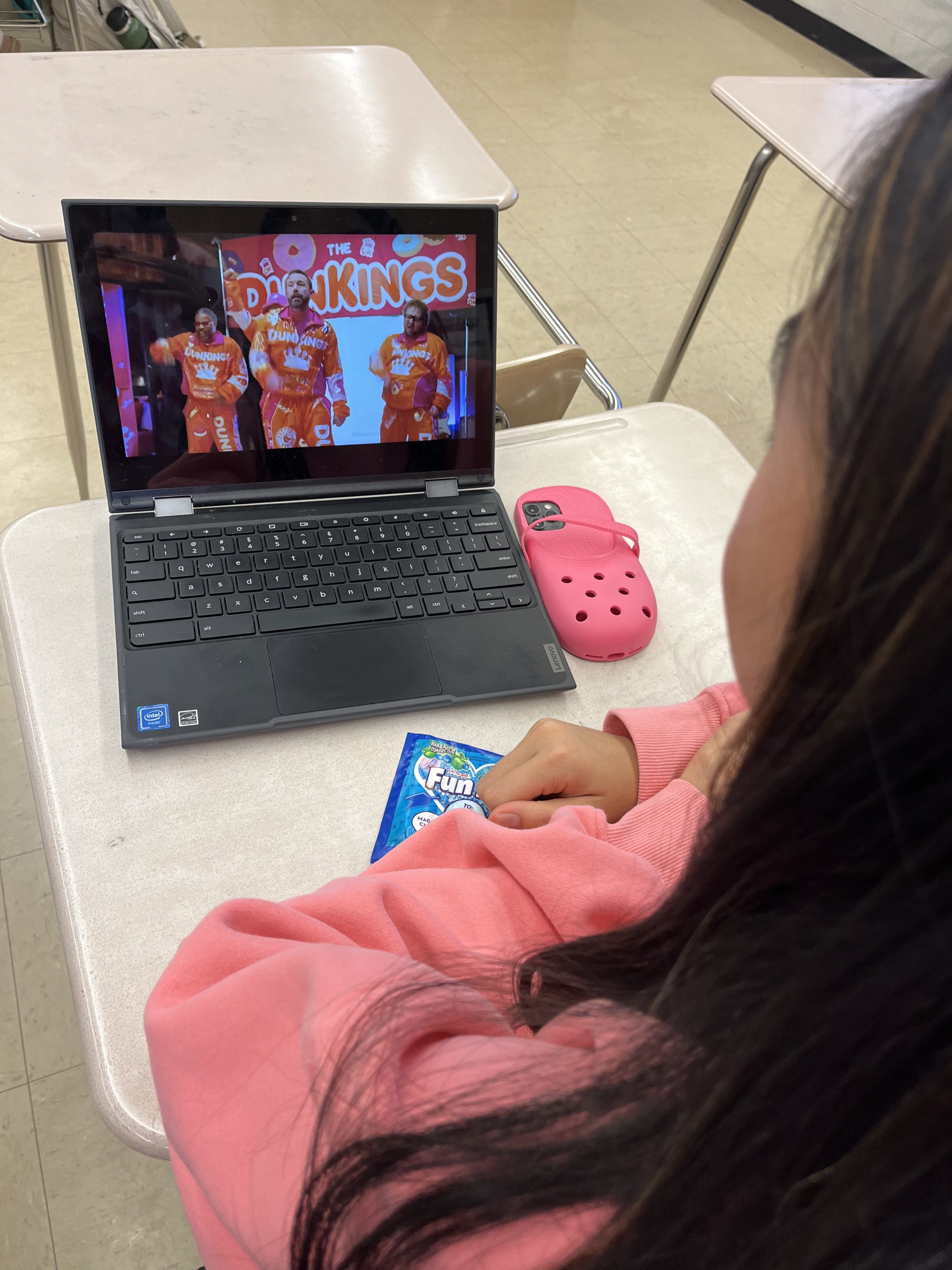 Sophomore Megan Lomotan watches Dunkin Donuts The DunKings Super Bowl commercial during extra class time in AP Gov.