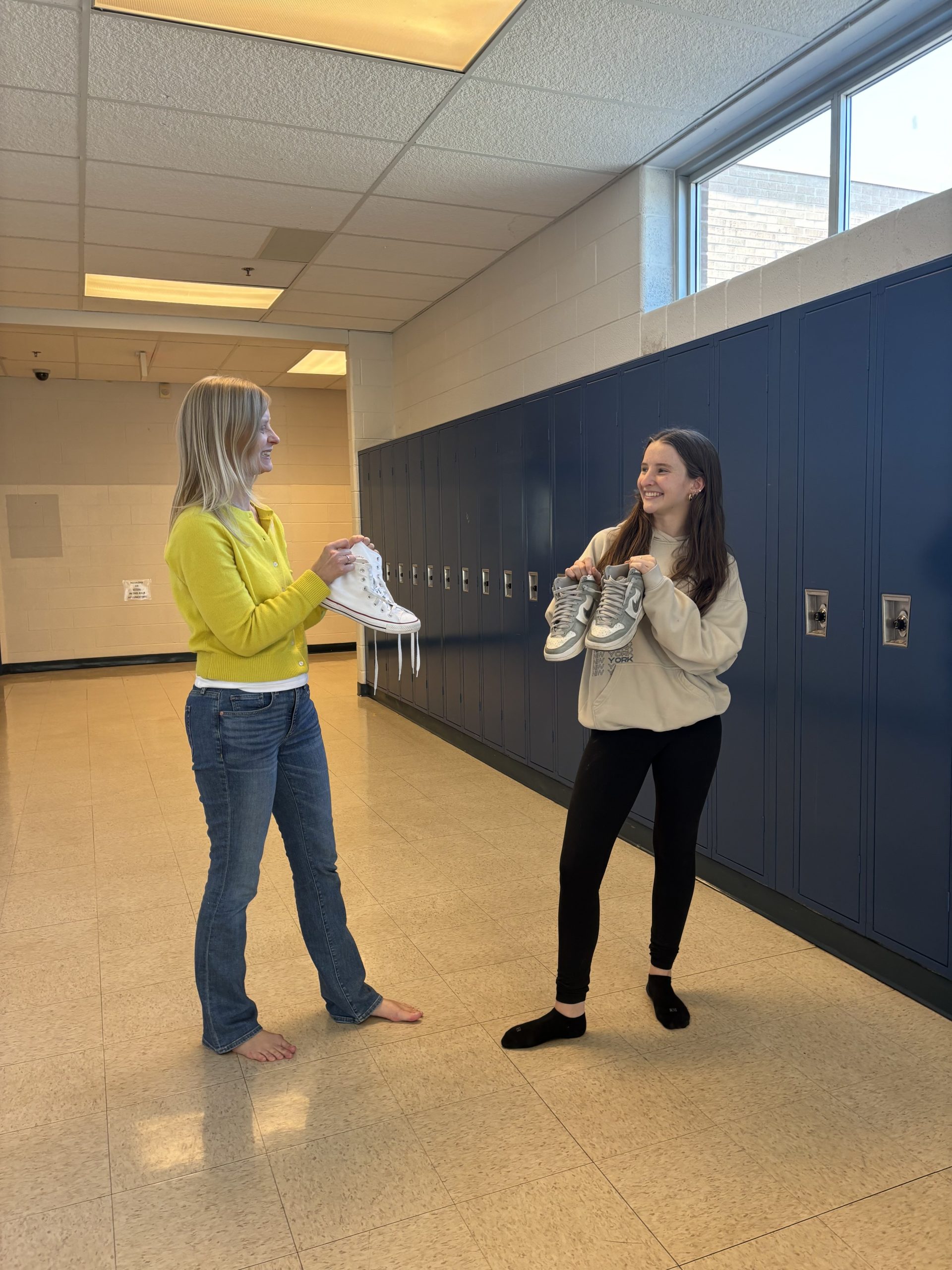 Senior Maya Halpern and social studies teacher Jennifer Bauer switch shoes as they experience each others day in the life. It was an eye-opening experience, and it was amazing to see how much she cares for her students, Halpern said.