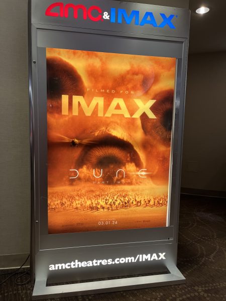 The IMAX poster for Dune: Part Two is displayed in the RIO AMC theater. The poster shows a critical scene in the film, where Paul leads an army of Fremen and Sandworms. Frank Herbert wanted the book to be a cautionary tale, a warning against charismatic religious leaders, the films director Denis Villeneuve said.
