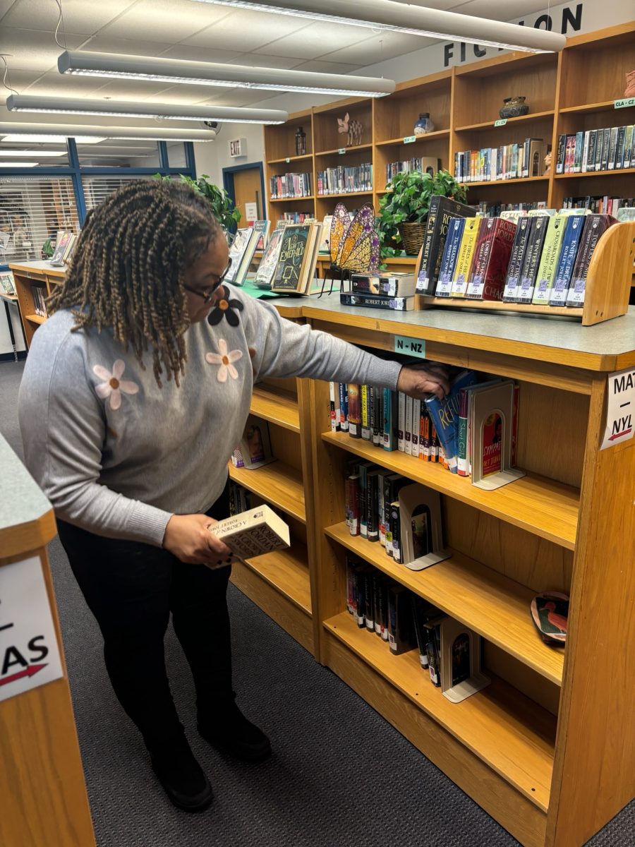 Media Specialist Tammie Burk picks out books for her monthly themed display. She chooses books based on important topics happening that month as well as whats popular.