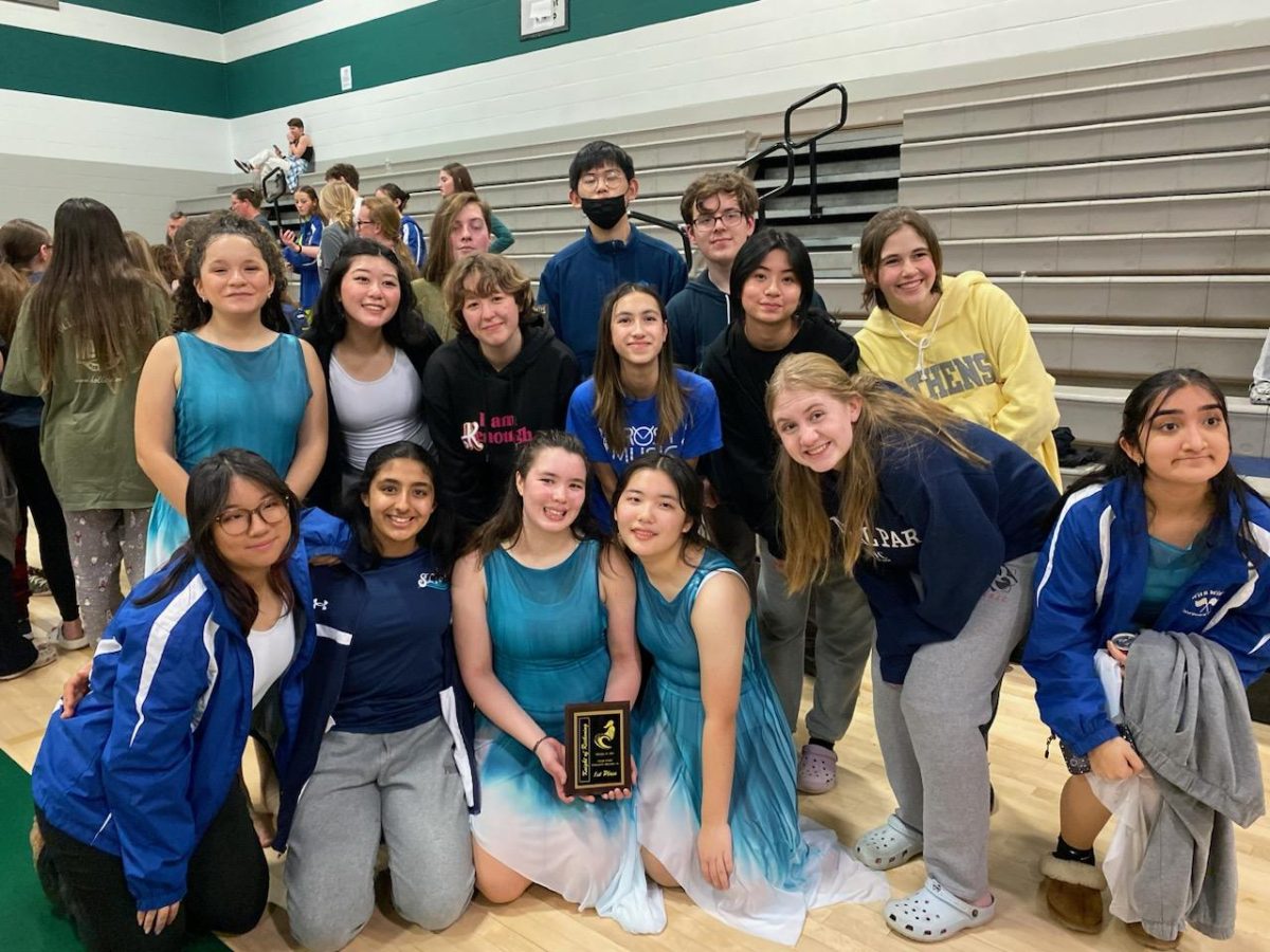 The+North+Potomac+Area+Color+Guard+takes+a+group+picture+after+winning+first+place+in+the+Scholastic+Regional+AA+division+at+their+first+competition+of+the+winter+season.+Guard+helped+me+create+so+many+great+memories+with+my+teammates%2C+sophomore+Summer+Yao+said.