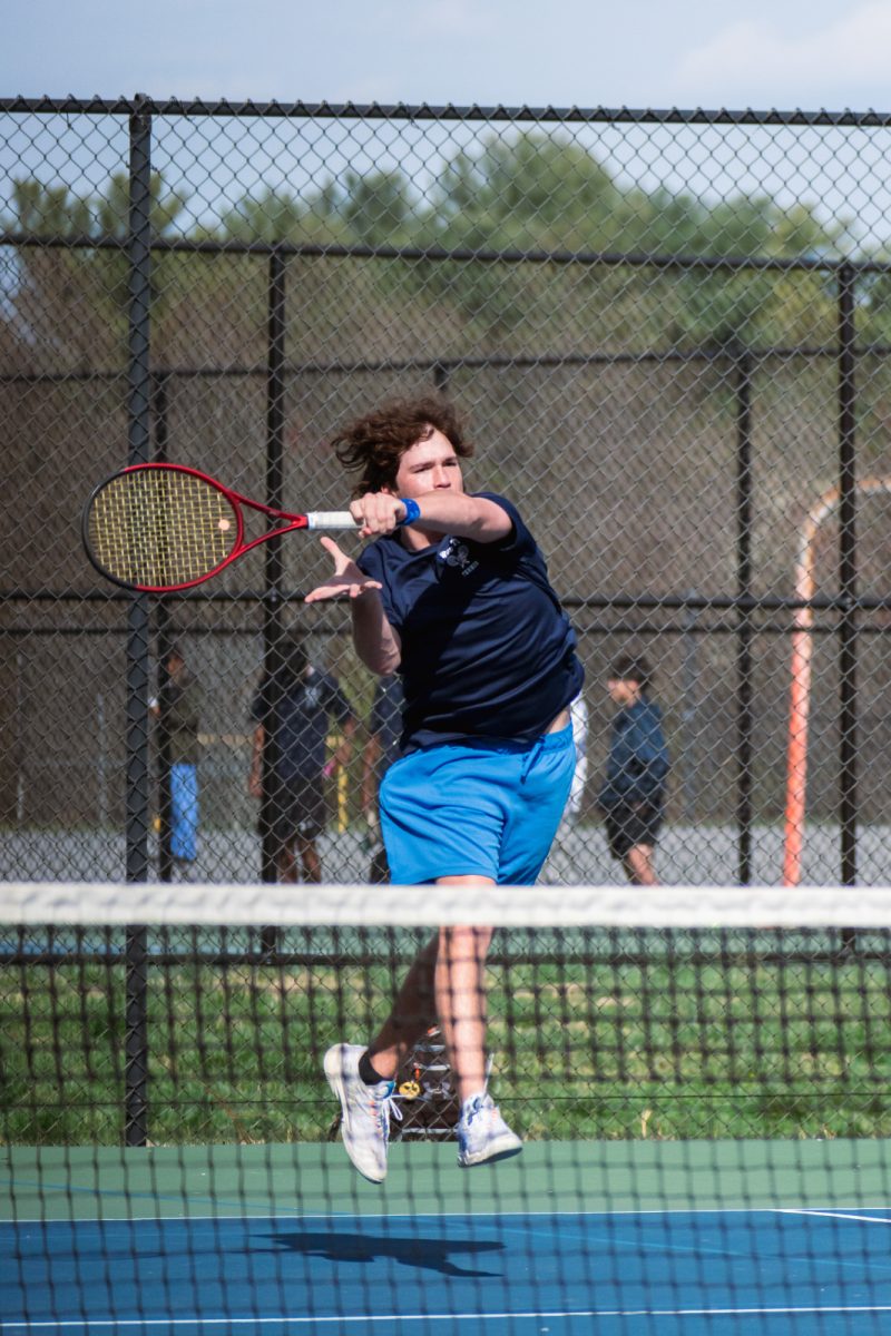 Junior Will Balian, a doubles player, hits a forehand against Walter Johnson on Mar. 29 of the 2023 season, the game ended in a 7-0 win.
