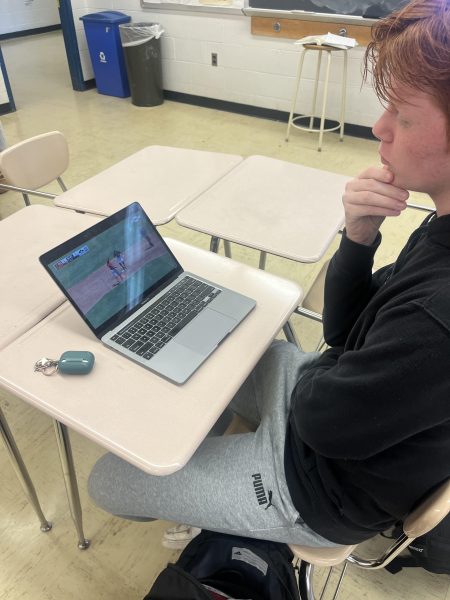 Sophomore James Colvin watches highlights from a Yankees v Red Sox spring training game. Im really excited to watch the Yankees this season. Weve made so many improvements this year and I think theyre going to be a fun team, Colvin said.